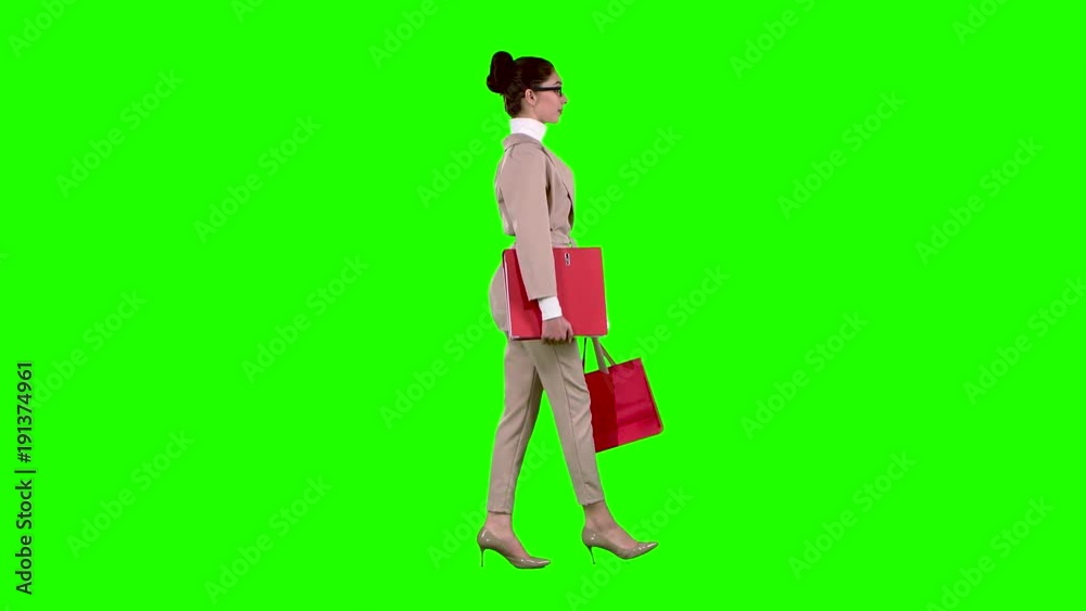 Girl goes shopping in the store. Green screen. Slow motion Girl goes shopping in the store. Green screen. Slow motion