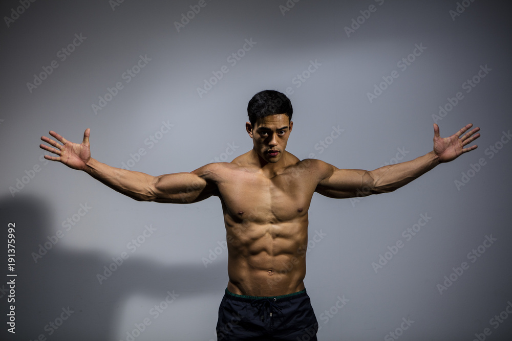 Asian Bodybuilder Displaying Wingspan 