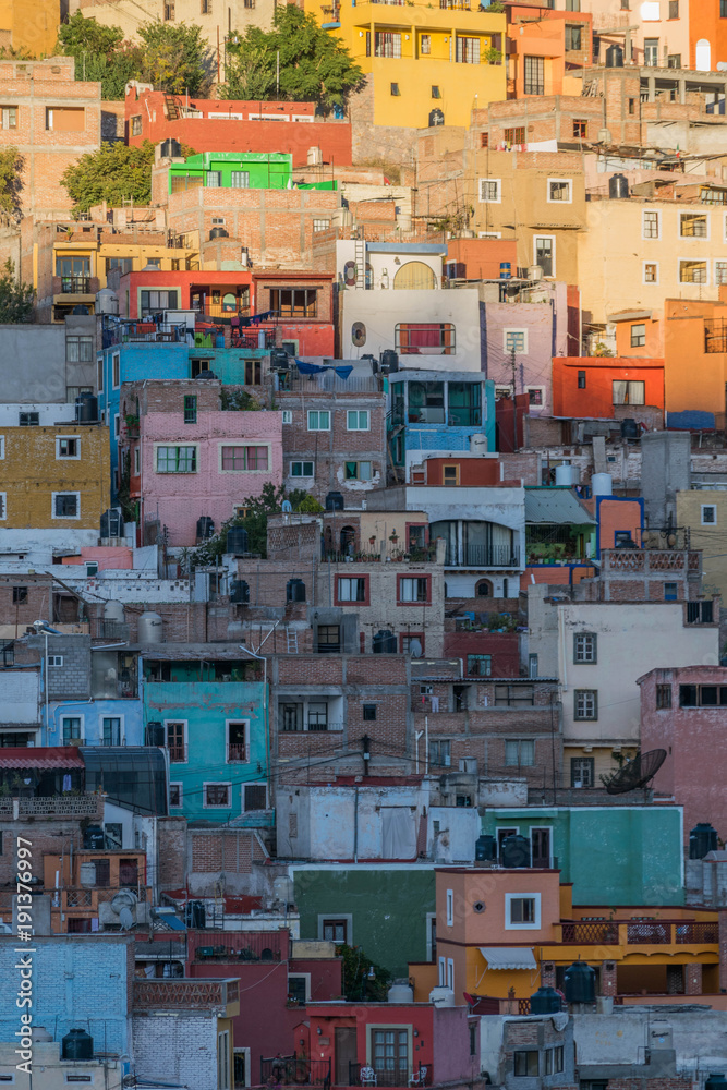 Isolated shot of many colorful houses, dotting the hillside, in Guanajuato, Mexico