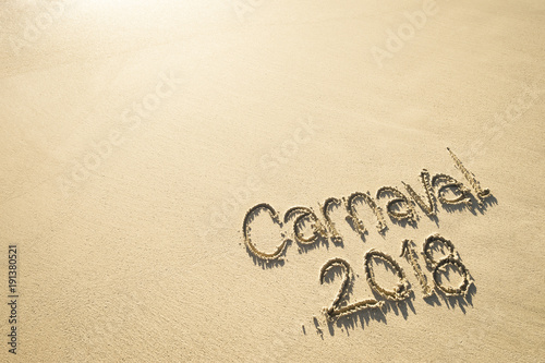 Message for Carnaval 2018 written on smooth sand beach