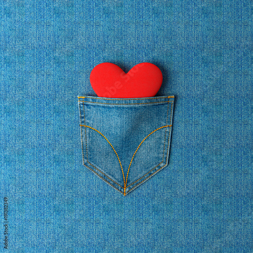 Jeans pocket with a heart inside on a jeans background. 3d illustration and rendering.