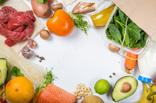 Grocery shopping concept. Balanced diet concept. Fresh foods with shopping bag on white background