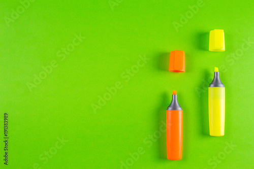 Markers highlighter pens on greenery background