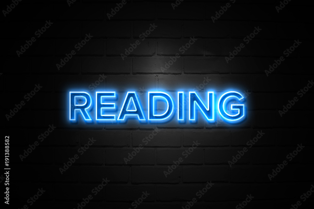 Reading neon Sign on brickwall Reading neon Sign on brickwall