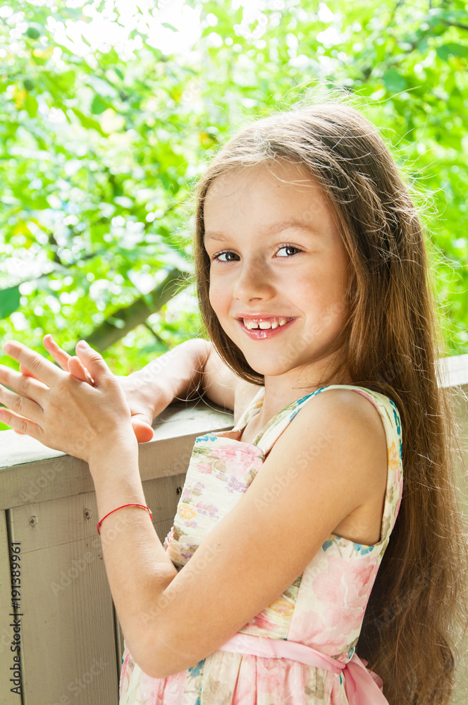 Beautiful little girl in summer background Beautiful little girl in summer background