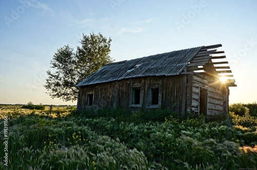 hut at sunset in the steppe
