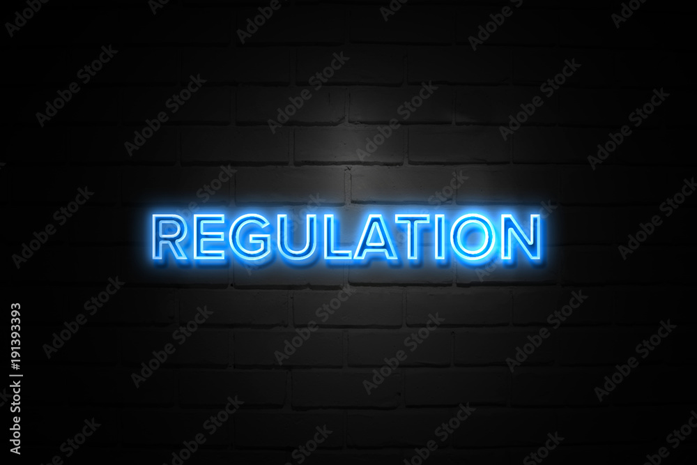 Regulation neon Sign on brickwall Regulation neon Sign on brickwall
