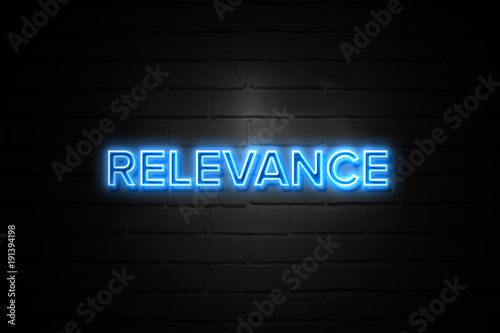 Relevance neon Sign on brickwall photo