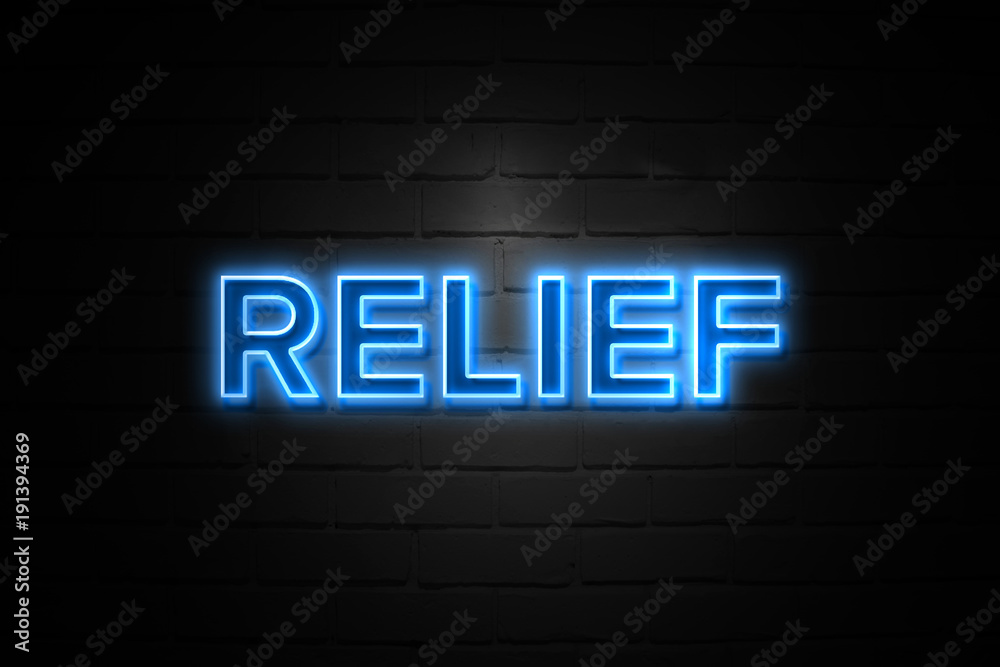 Relief neon Sign on brickwall Relief neon Sign on brickwall