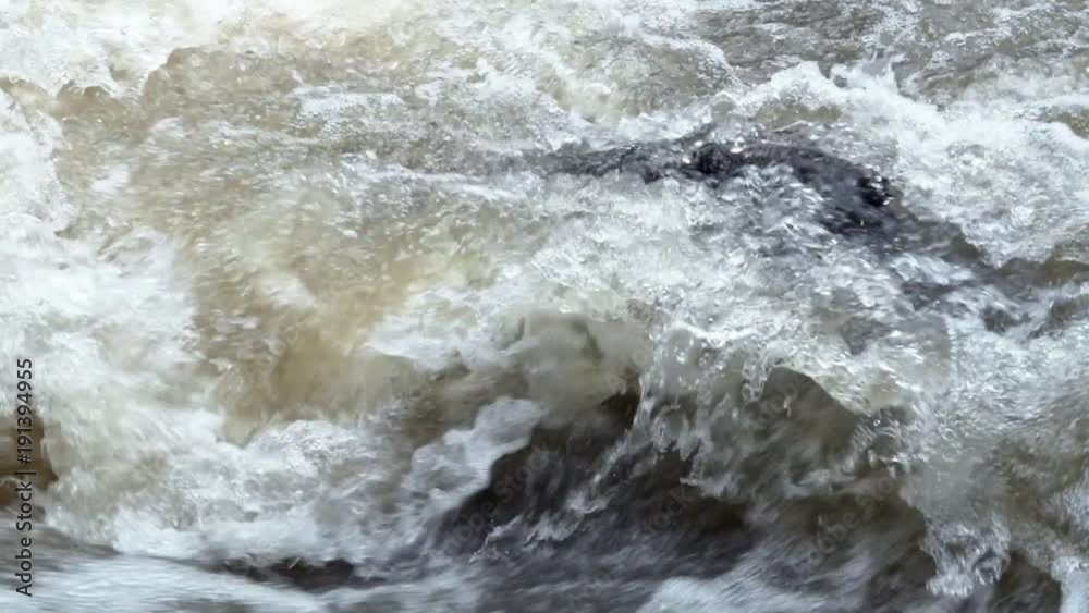 Water flowing through waterfall. Slow motion shot. White water in thailand. Water flowing through waterfall. Slow motion shot. White water in thailand.