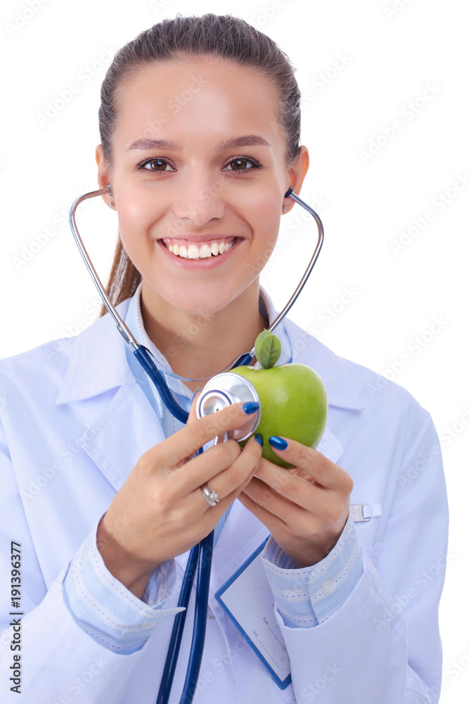 Medical doctor woman examining apple with stethoscope. Woman doctors Medical doctor woman examining apple with stethoscope. Woman doctors
