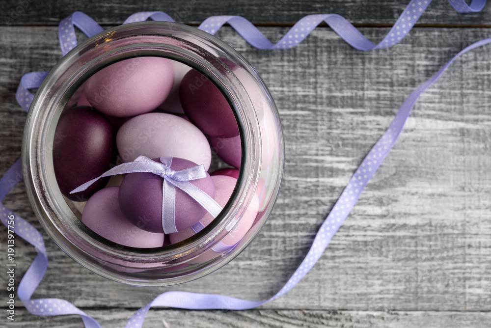 Easter eggs in fashionable colors on a gray wooden background Easter eggs in fashionable colors on a gray wooden background