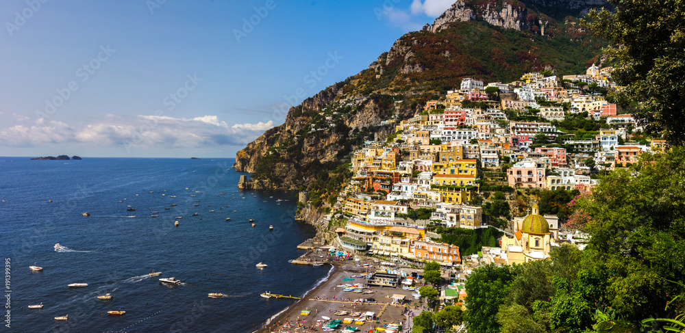 beach streets and colorful houses on the hill in Positano on Amalfi Coast in Italy 