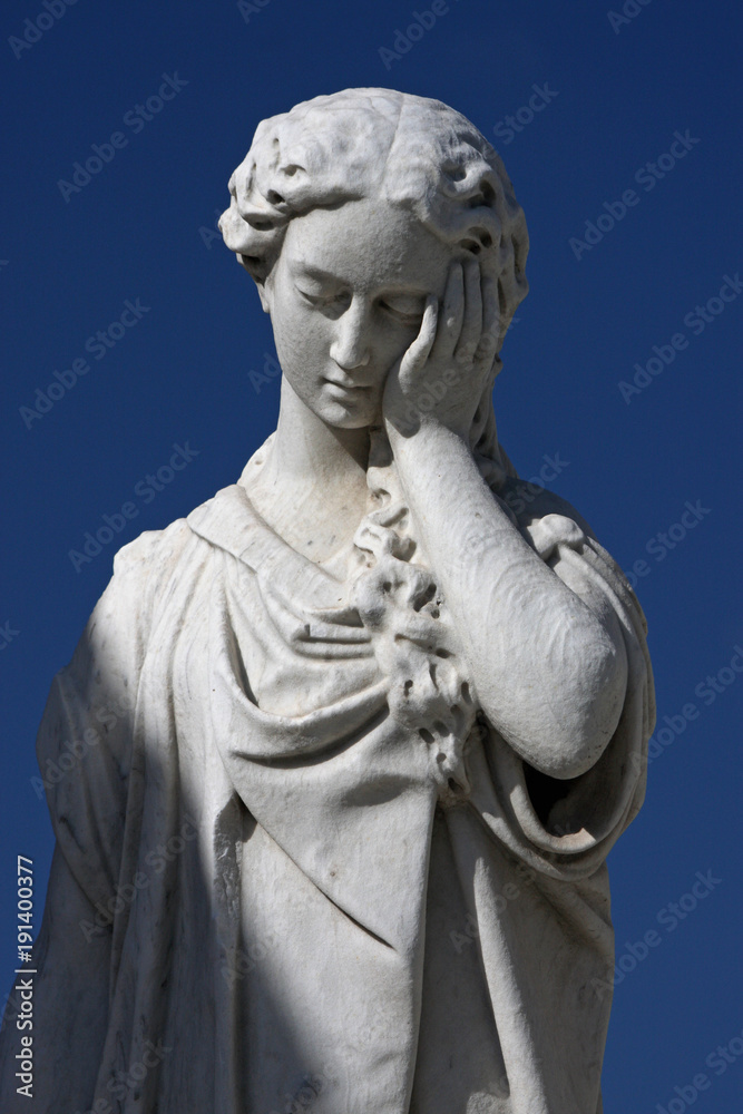 Facepalm statue in front of blue sky