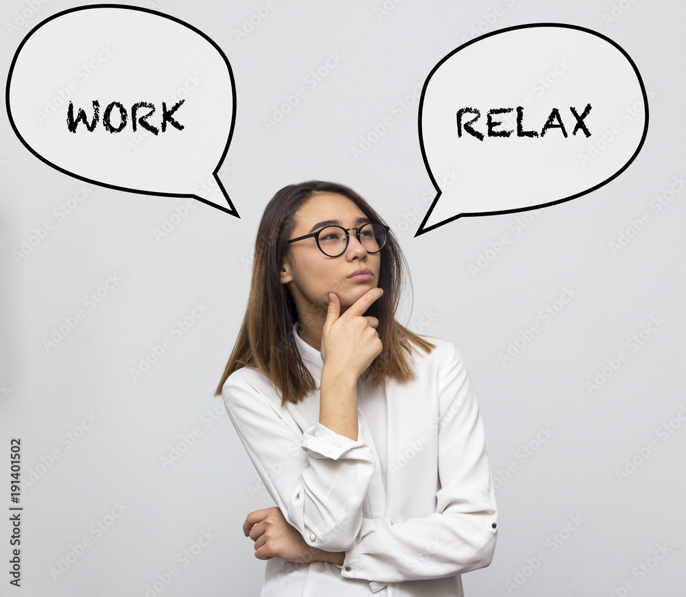 Young pretty asian woman thinking about choice between working hard and relax. Businesswoman choosing concept. Selective focus and shallow DOF Young pretty asian woman thinking about choice between working hard and relax. Businesswoman choosing concept. Selective focus and shallow DOF