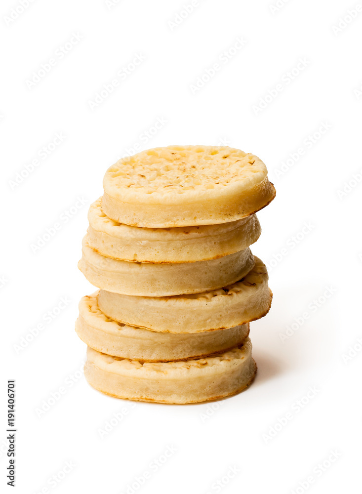Hot toasted crumpets isolated on white Hot toasted crumpets isolated on white