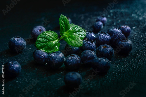 Blueberry fruit on stone background. Healthy forest fruit. Delicious fresh berries.
