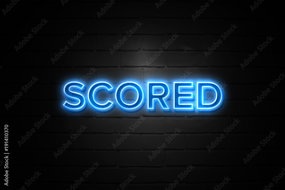 Obraz premium Scored neon Sign on brickwall