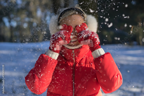 Young attractive woman covers her eyes with hearts. St. Valentine's Day