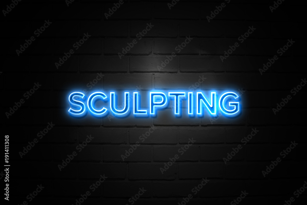 Sculpting neon Sign on brickwall Sculpting neon Sign on brickwall