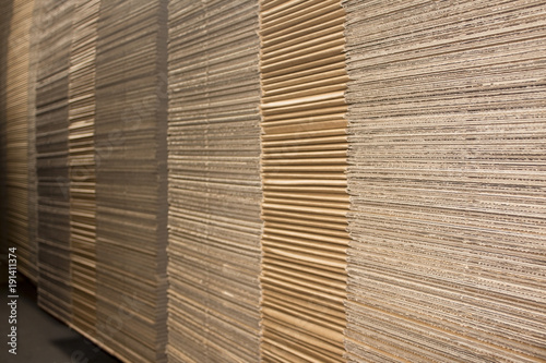 Stack of flat industrial folding cardboard packaging boxes