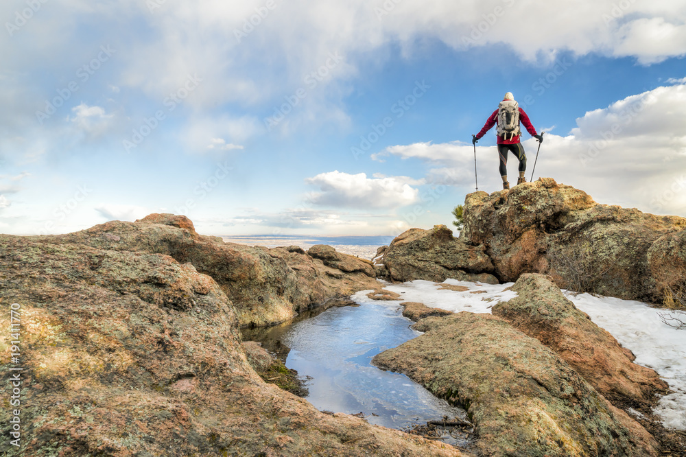 mature backpacker on a mountain ridge