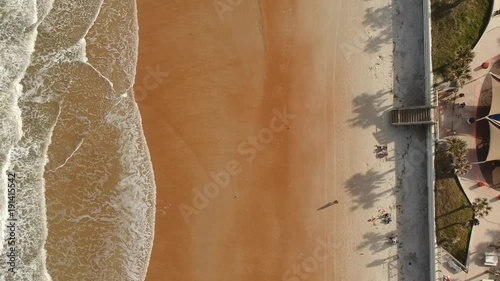 Flying up the beach coast line from above