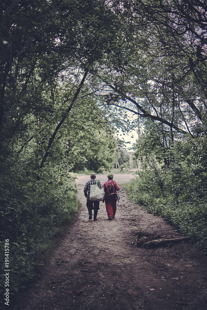 Elderly couple walking in park Elderly couple walking in park