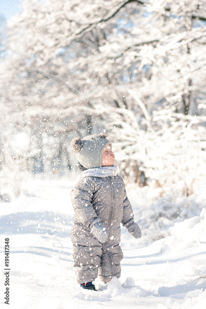 child in the forest in the snow