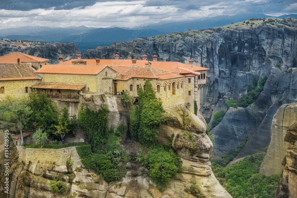 Beautiful and traditional Christian monastery in retro color in Meteora region, Greece