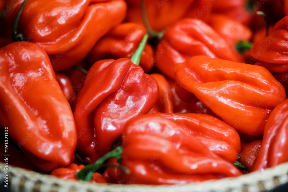 close up red habanero peppers in basket close up red habanero peppers in basket