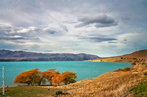 Beautiful torquise lake in autumn in New Zealand photo