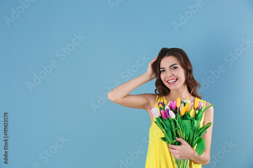 Beautiful woman holding bou...