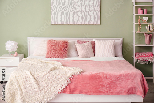 Light room interior with bed