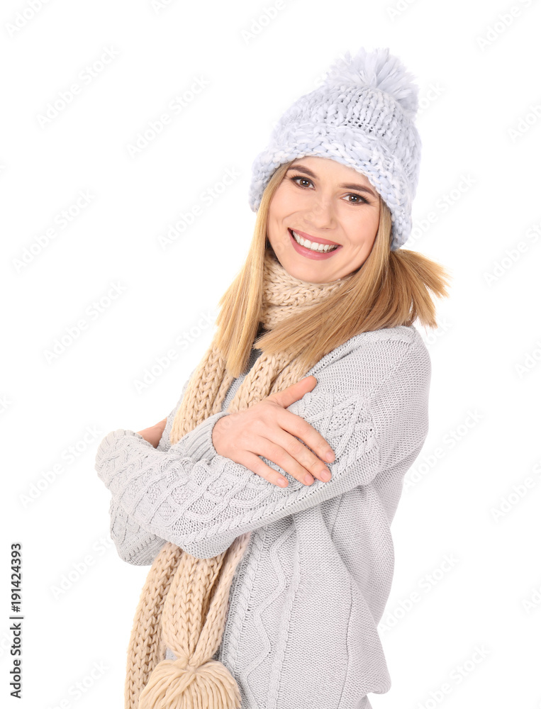 Young woman in warm clothing on white background. Ready for winter vacation