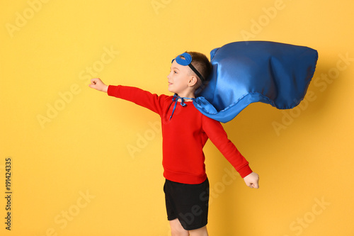 Cute boy in superhero costu...