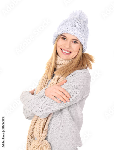 Young woman in warm clothing on white background. Ready for winter vacation