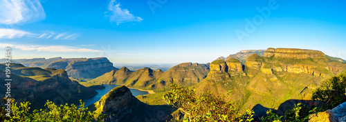 Panorama view of a Sunset over Blyde Caniyon Dam and the three Rondavels of Blyde River Canyon Nature Reserve on the Panorama Route in Mpumalanga Province of South Africa photo