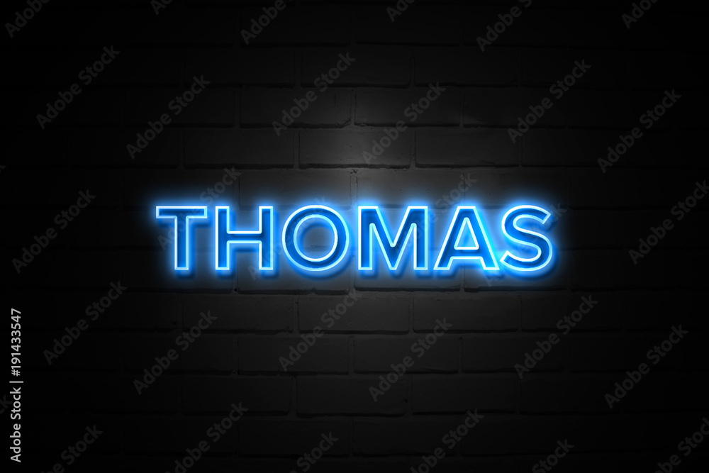 Thomas neon Sign on brickwall