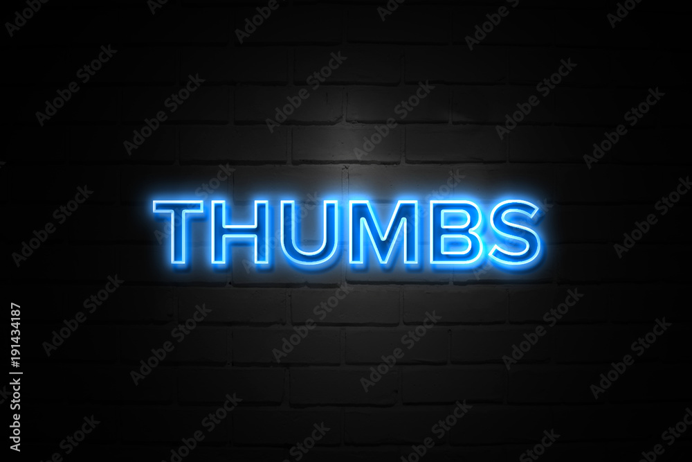 Thumbs neon Sign on brickwall