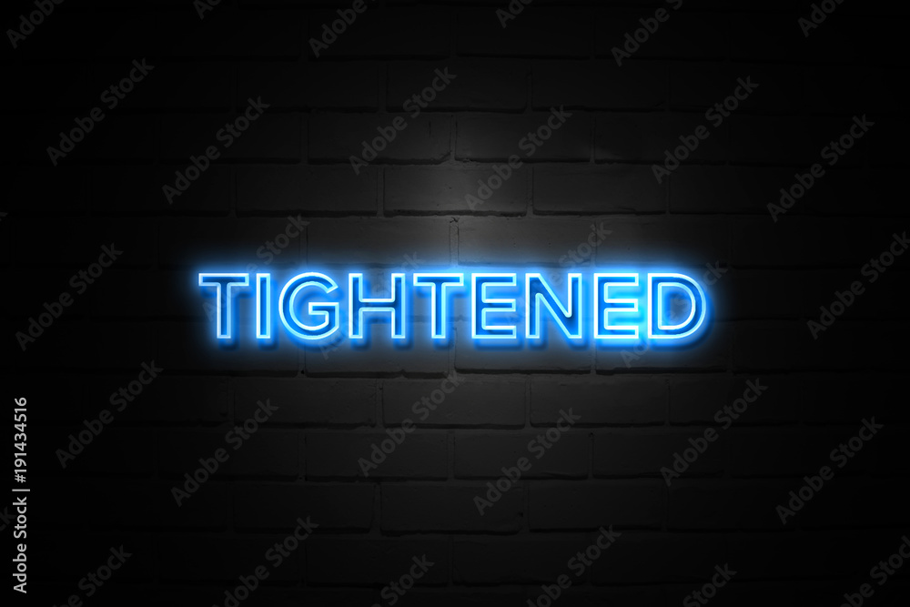Tightened neon Sign on brickwall Tightened neon Sign on brickwall