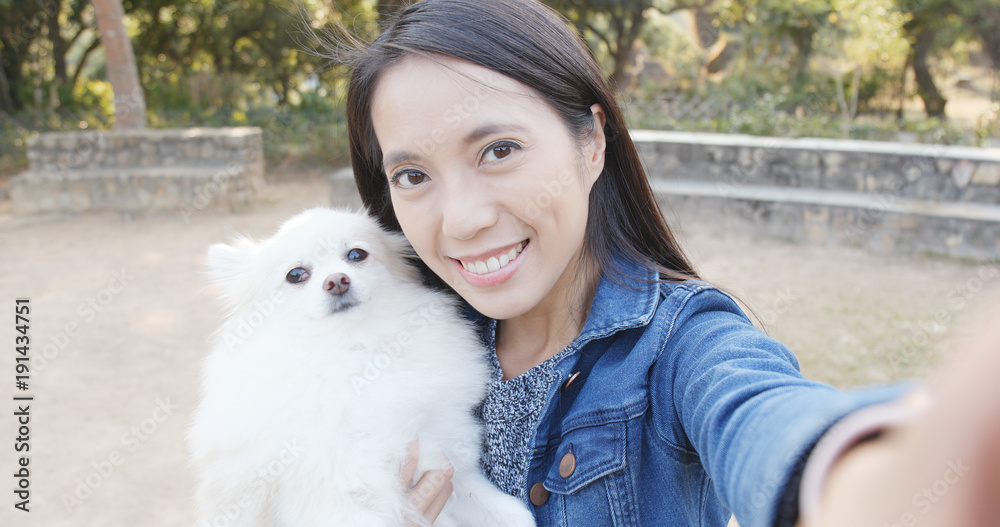 Woman taking photo selfie with her dog Woman taking photo selfie with her dog
