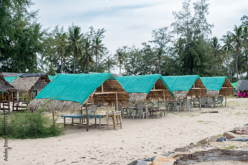 Restaurant thatched roof wooden huts on the beach
