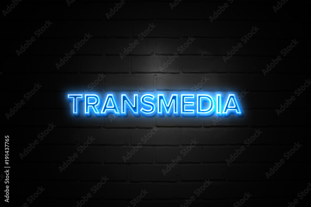 Transmedia neon Sign on brickwall Transmedia neon Sign on brickwall
