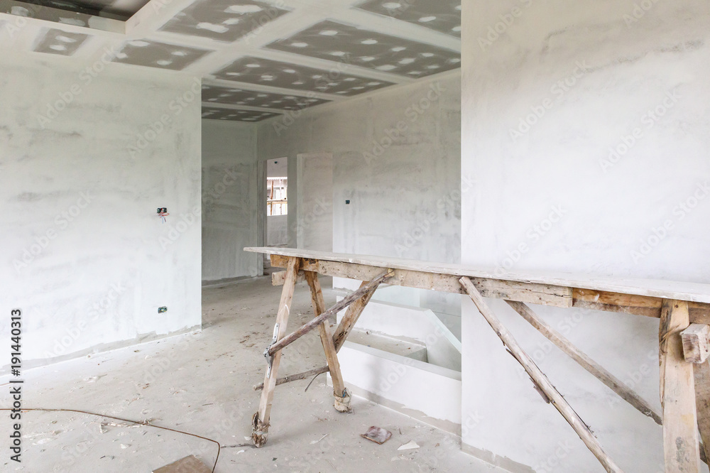Empty room interior with gypsum board ceiling at construction site Empty room interior with gypsum board ceiling at construction site