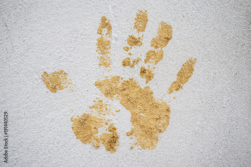 hand print on cement wall