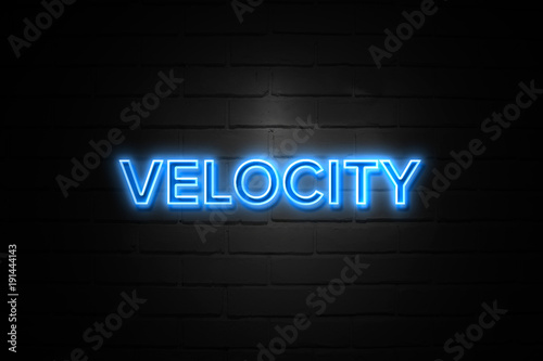 Velocity neon Sign on brickwall