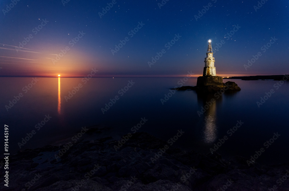 The rise of the full moon over the Lighthouse, Bulgaria