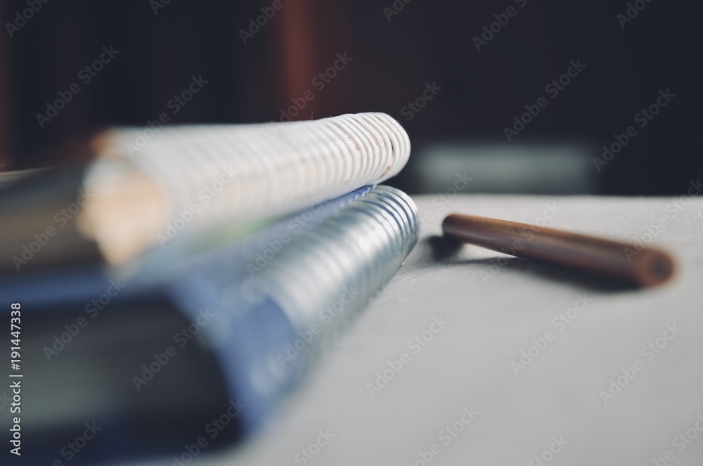 Naklejka premium Depth of field of Loop binding book on the bed with light from the window on the morning concept of education and business
