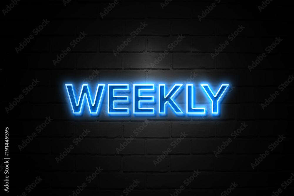 Weekly neon Sign on brickwall Weekly neon Sign on brickwall
